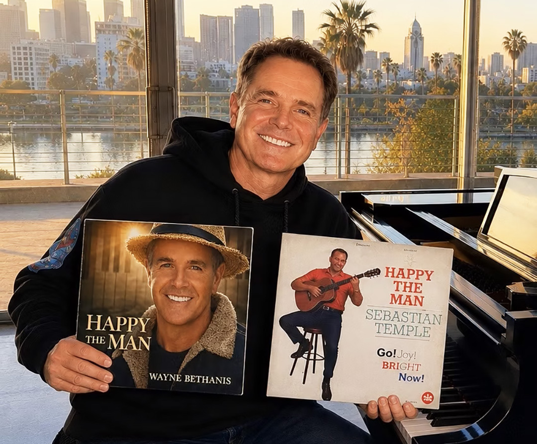 Happy the Man - Wayne Bethanis holding two album covers